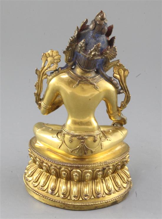 A gilt Tibetan gilt bronze seated figure of Green Tara, 18th century, height 21.5cm